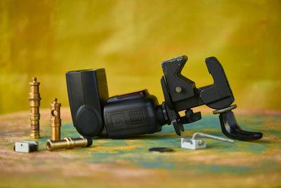 Close-up of camera and metal on table