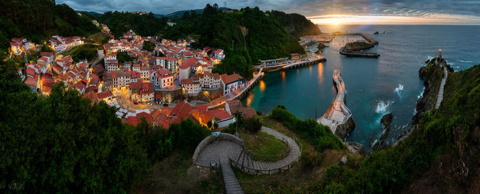 High angle view of townscape by lake