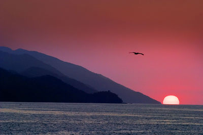 Scenic view of mountains against sky during sunset