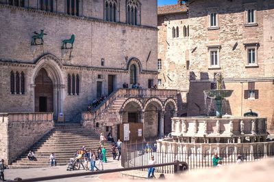 Group of people in front of historical building in perugia