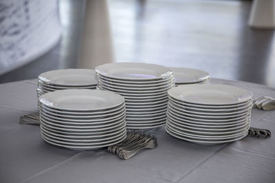 Stacked plates on tablecloth