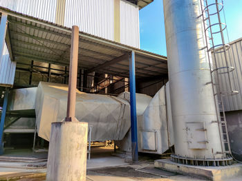 Metallic structure against sky in factory