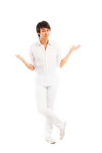 Young woman standing against white background