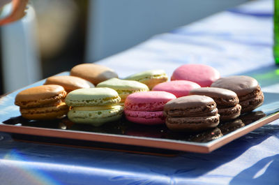Freshly baked french macaroons at bakery shop