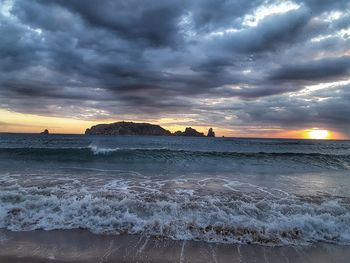 Scenic view of sea against cloudy sky