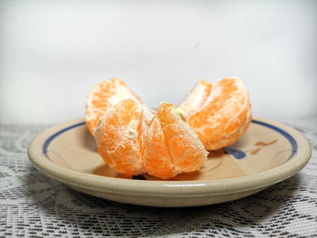 Close-up of orange slice in plate