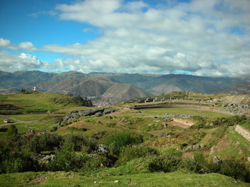 Scenic view of landscape and mountains against sky