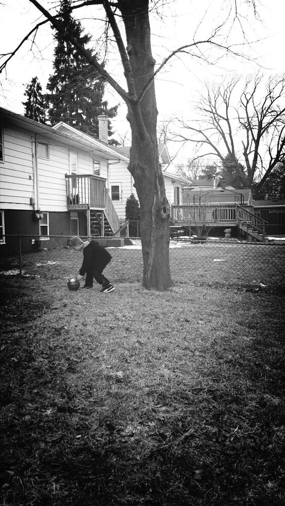 building exterior, architecture, built structure, tree, lifestyles, full length, bare tree, men, walking, grass, rear view, person, leisure activity, city, residential structure, house, day, residential building