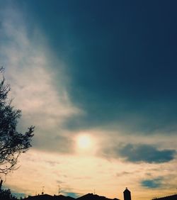 Low angle view of silhouette trees against sky during sunset