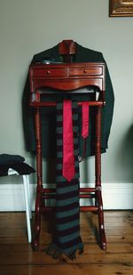 Blazer with necktie and scarf on drawer