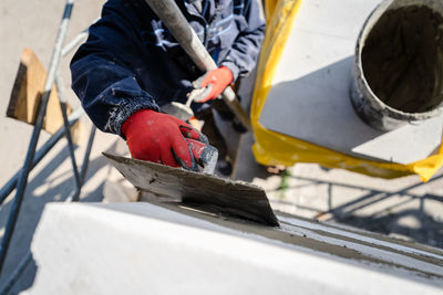 Low section of man working at construction site