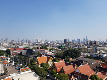 High angle view of buildings against clear sky