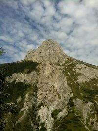 Scenic view of mountains against cloudy sky