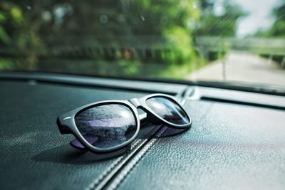 Close-up of sunglasses in car