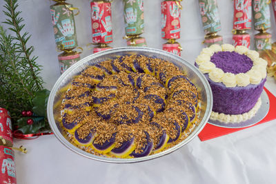 Close-up of candies with dessert on table