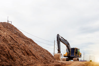 Low angle view of construction site against sky