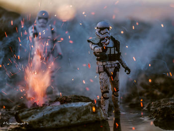 Man standing on fire in water