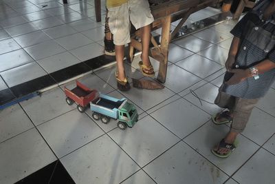 Low section of woman standing on floor