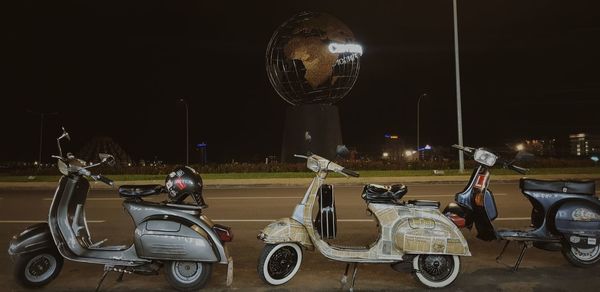 Bicycles parked on street at night