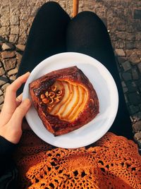 High angle view of hand holding coffee