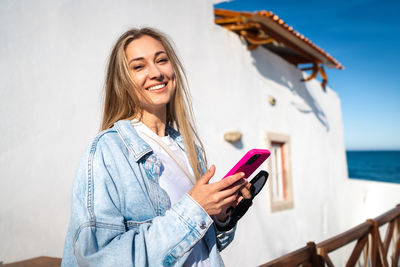 Young woman using mobile phone