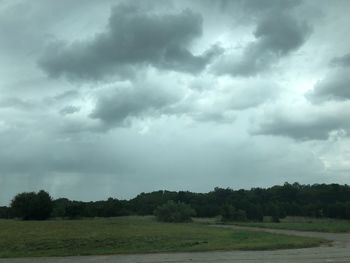 Scenic view of landscape against cloudy sky