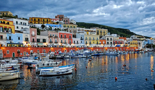 Boats moored at harbor