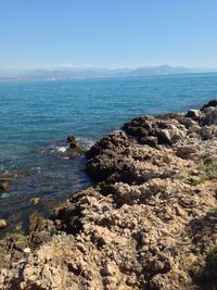 Scenic view of sea against blue sky