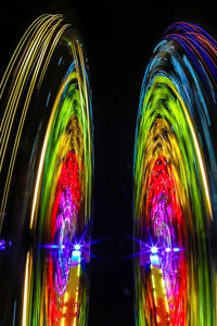 Digital composite image of illuminated lights against black background