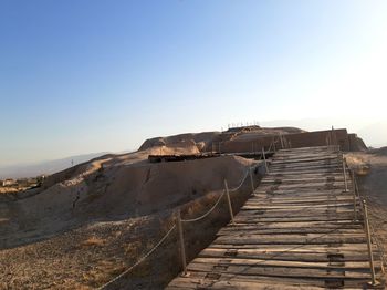 Scenic view of land against clear sky