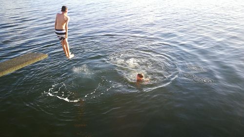 Children diving in sea