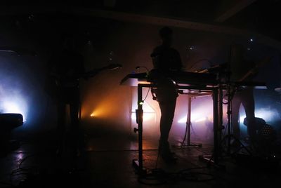 Man playing guitar at music concert