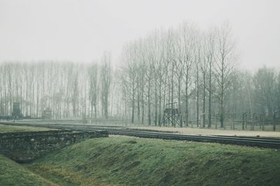 Scenic view of landscape against sky during winter