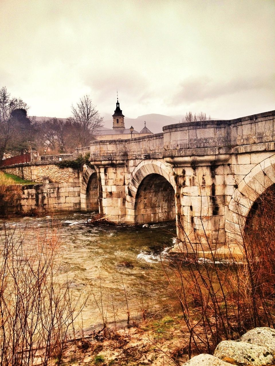 architecture, built structure, arch, building exterior, connection, sky, bridge - man made structure, arch bridge, water, river, history, cloud - sky, famous place, bridge, travel destinations, travel, the past, international landmark, day, outdoors