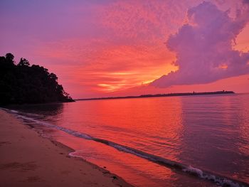 Scenic view of sea against romantic sky at sunset