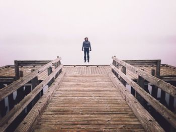 Low angle view of woman standing on steps