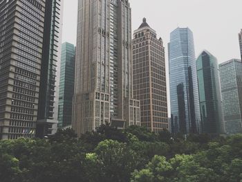 Low angle view of tall buildings against sky