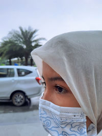 Close-up portrait of girl in car