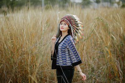 Young woman standing on field