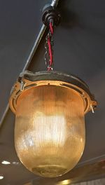 Low angle view of illuminated electric lamp