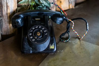 High angle view of telephone on table