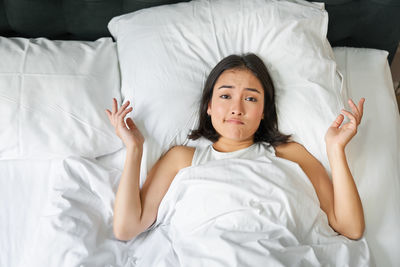 Young woman sleeping on bed at home