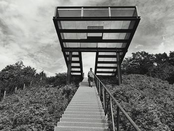 View of man walking on stairs black and white picture