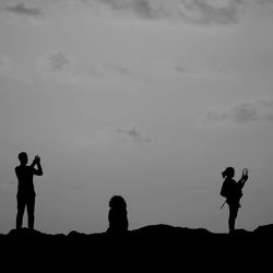 Silhouette of woman against sky