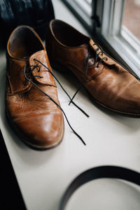 High angle view of shoes by window