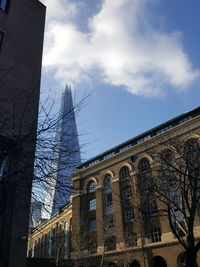 Low angle view of historical building against cloudy sky