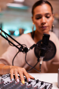 Portrait of young woman using mobile phone