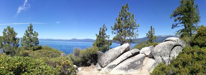 Panoramic view of sea against blue sky