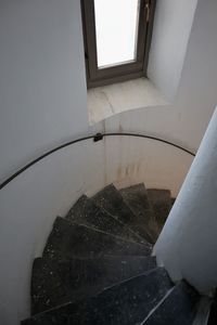 High angle view of broken glass window of building