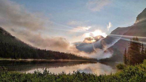 Scenic view of lake against cloudy sky